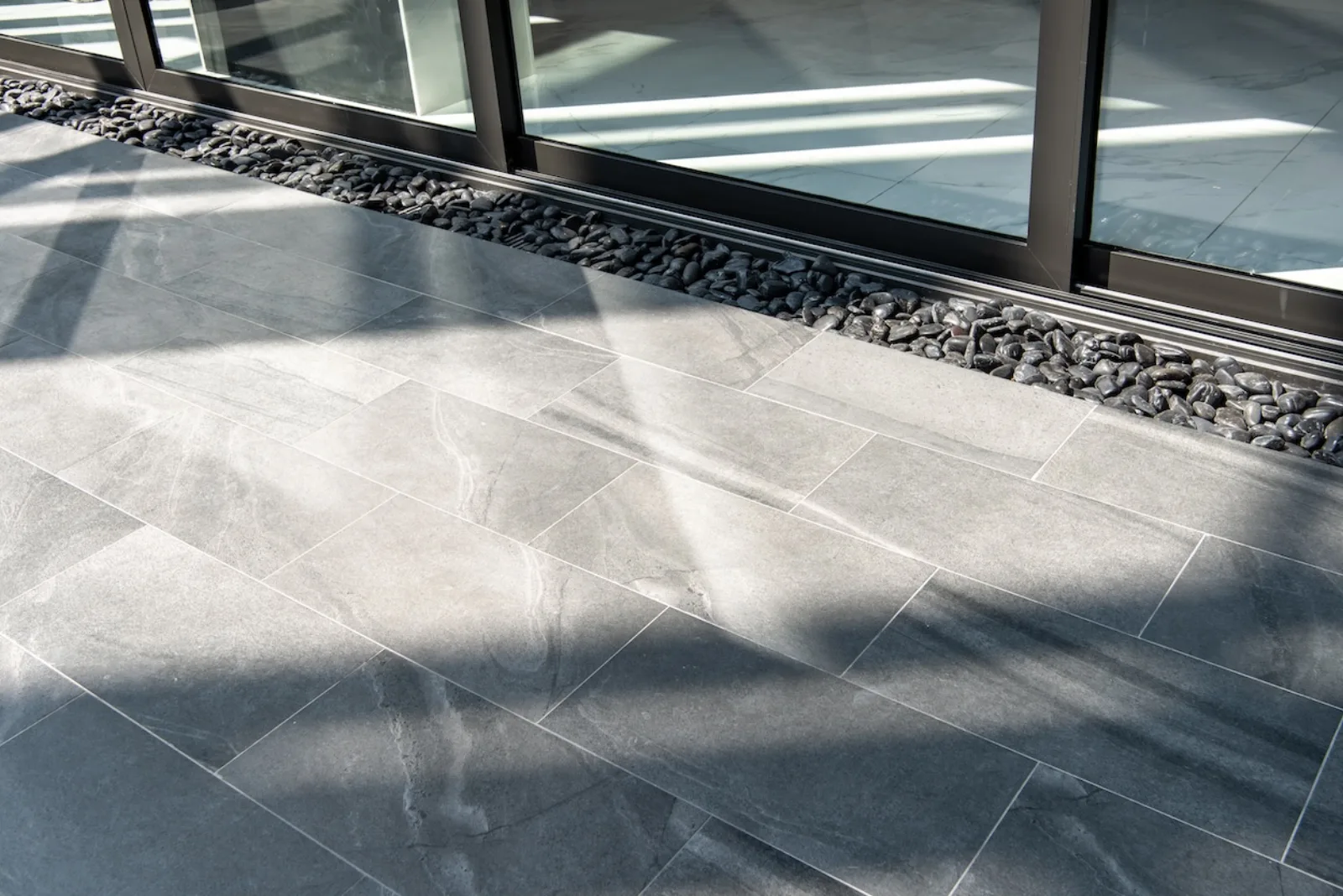 Large format tile flooring in afternoon light