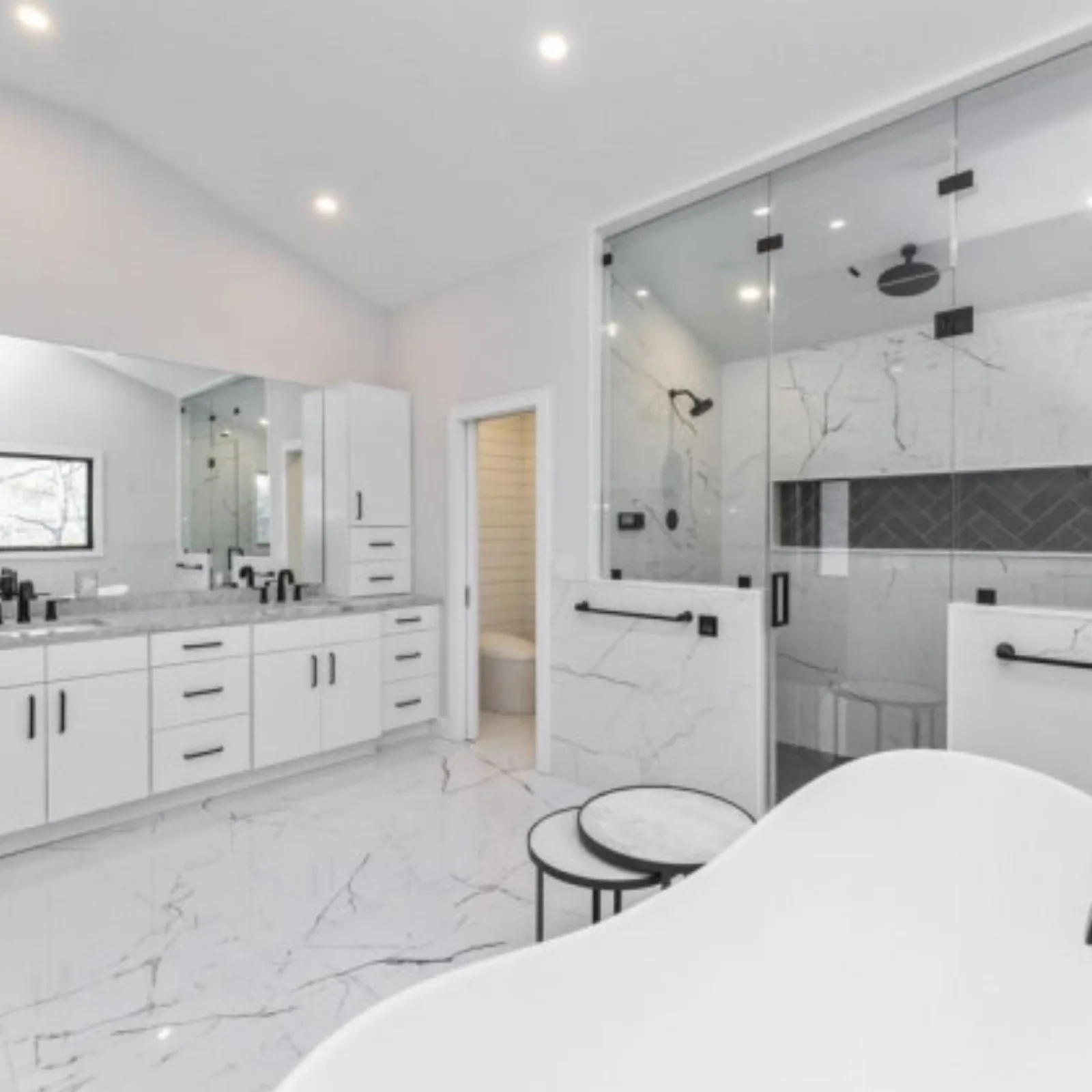 Marble bathroom with a freestanding tub and double vanity