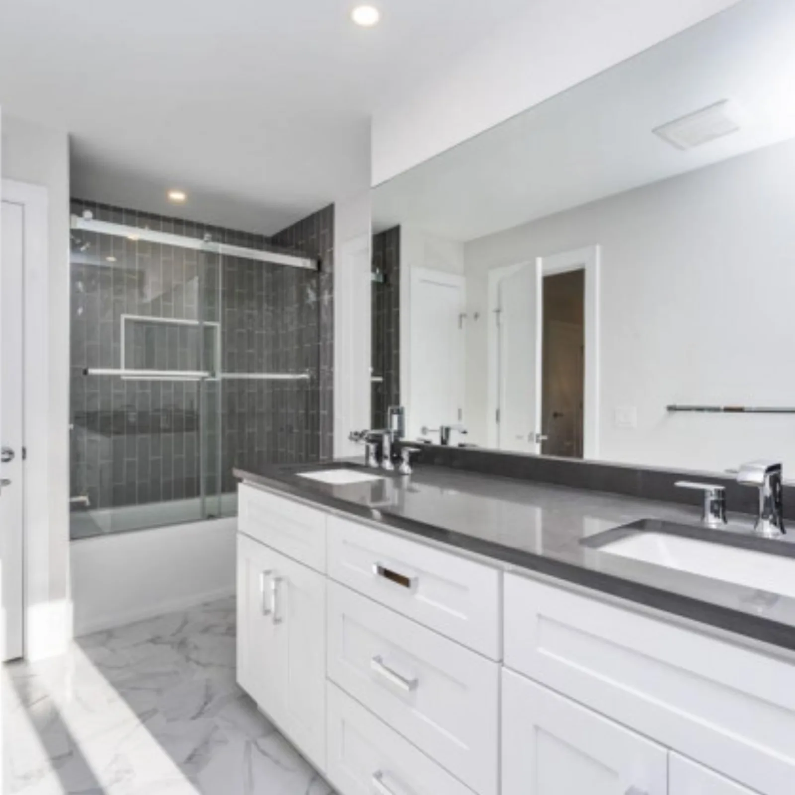 White double vanity with a grey stone countertop