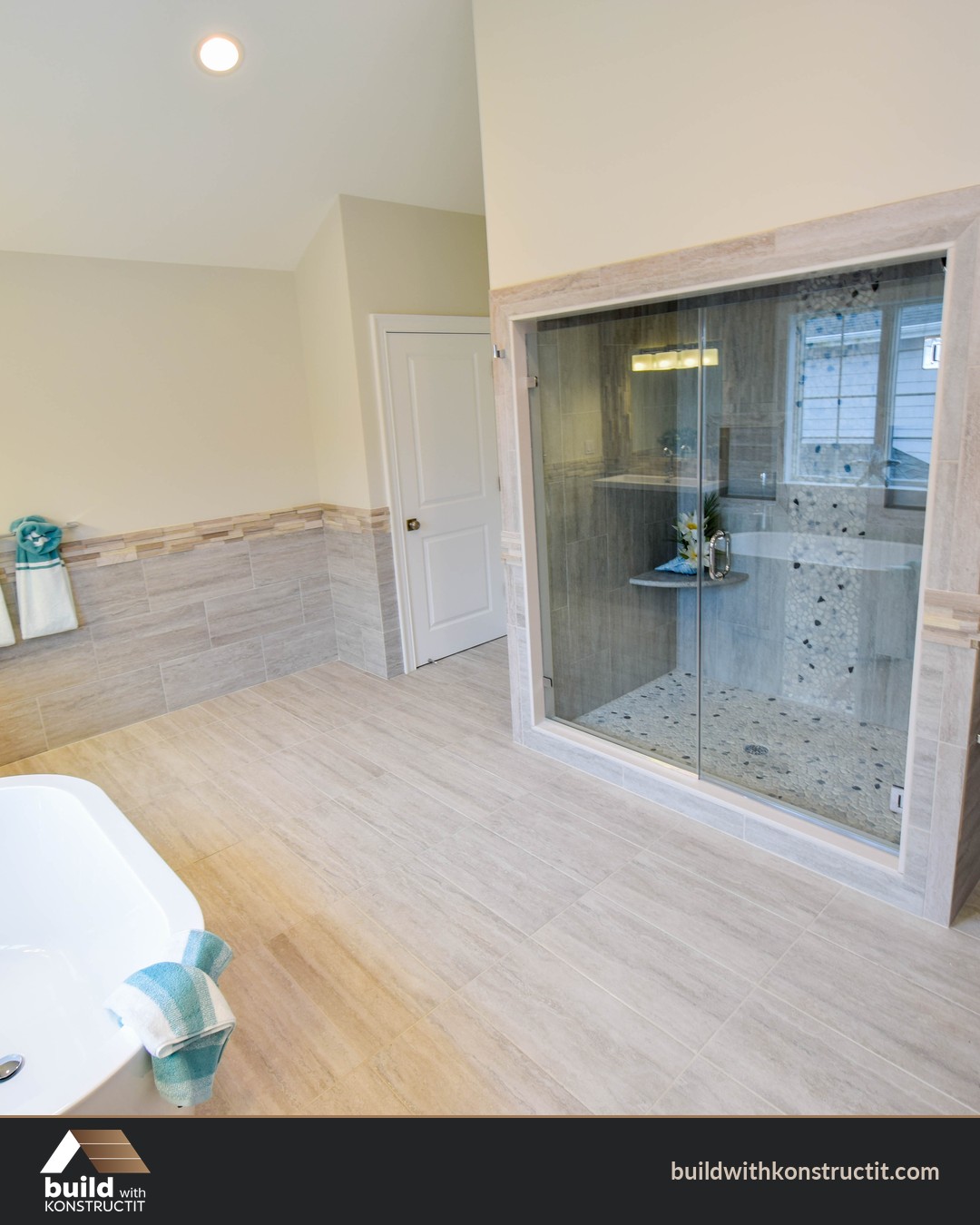 Freestanding Tub Under a Chandelier