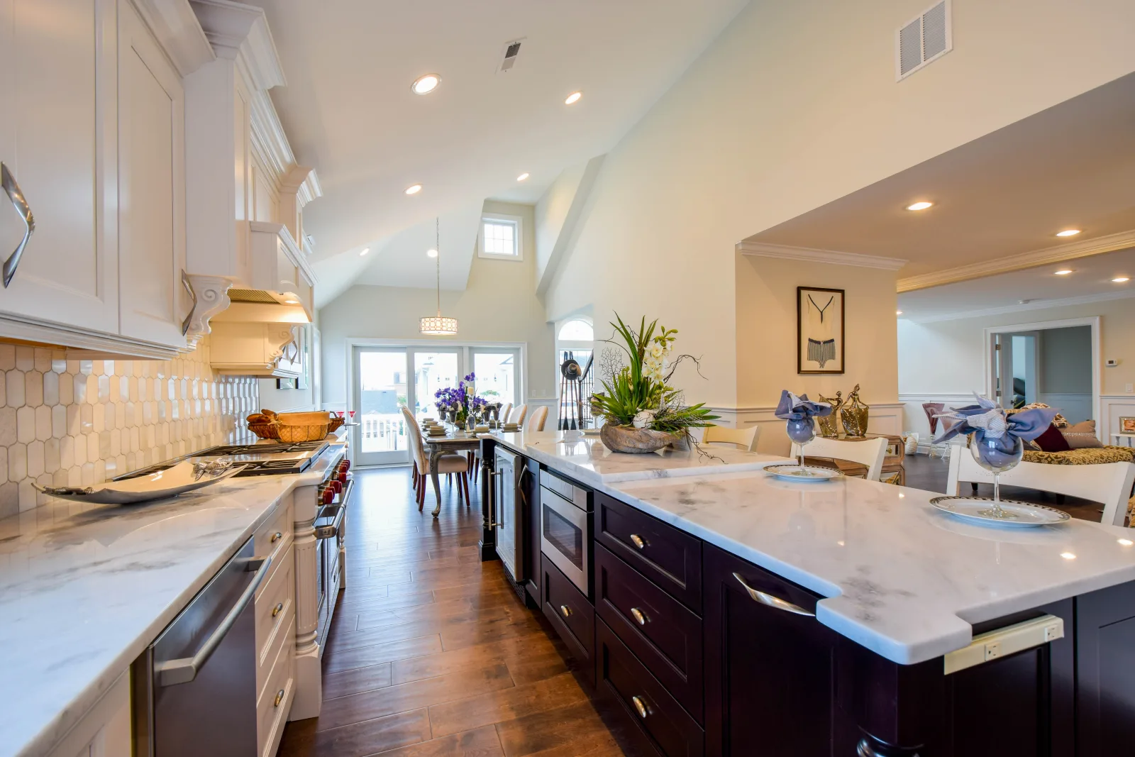 Dark wood island with a marble countertop and stainless appliances