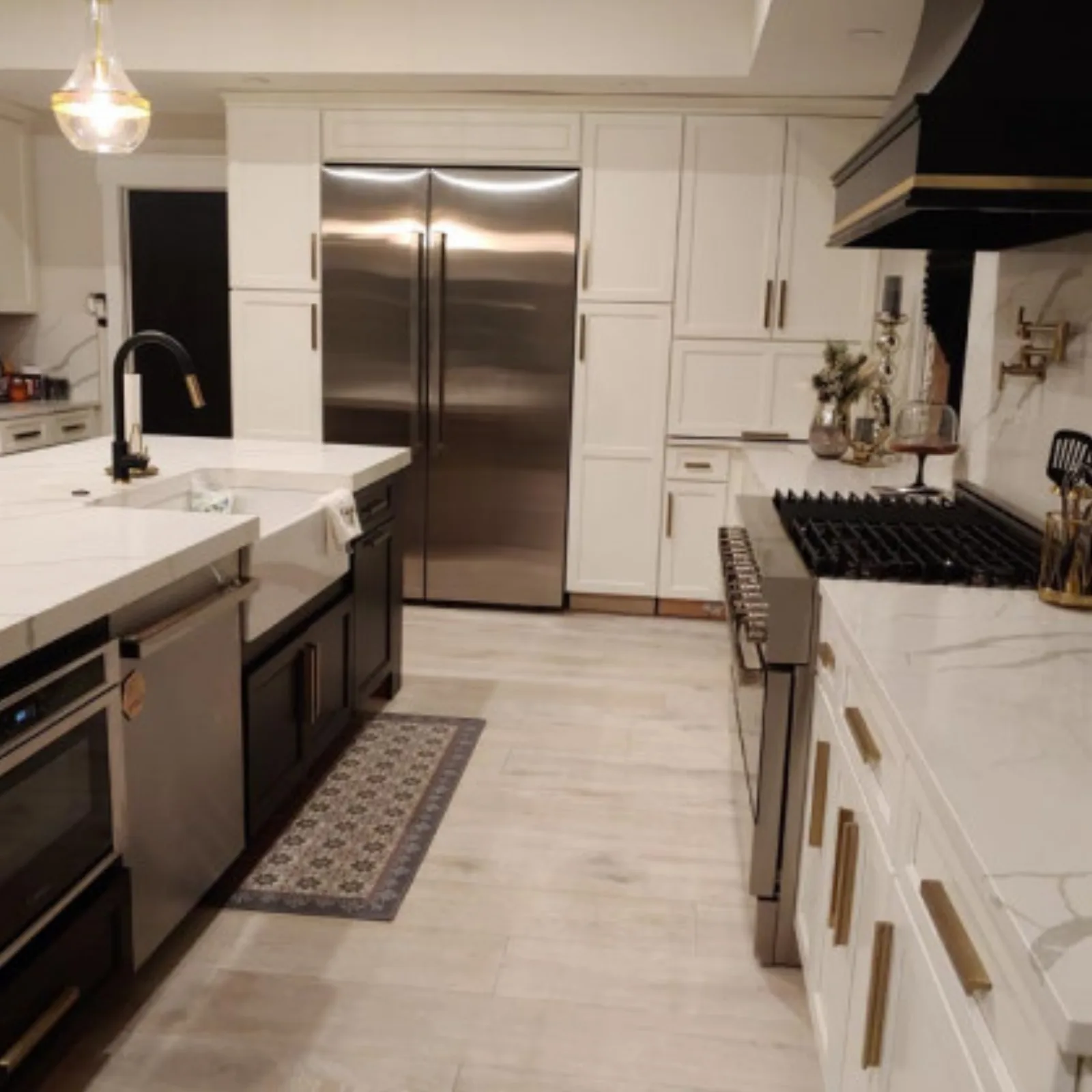 White kitchen with a farmhouse sink and stone backsplash