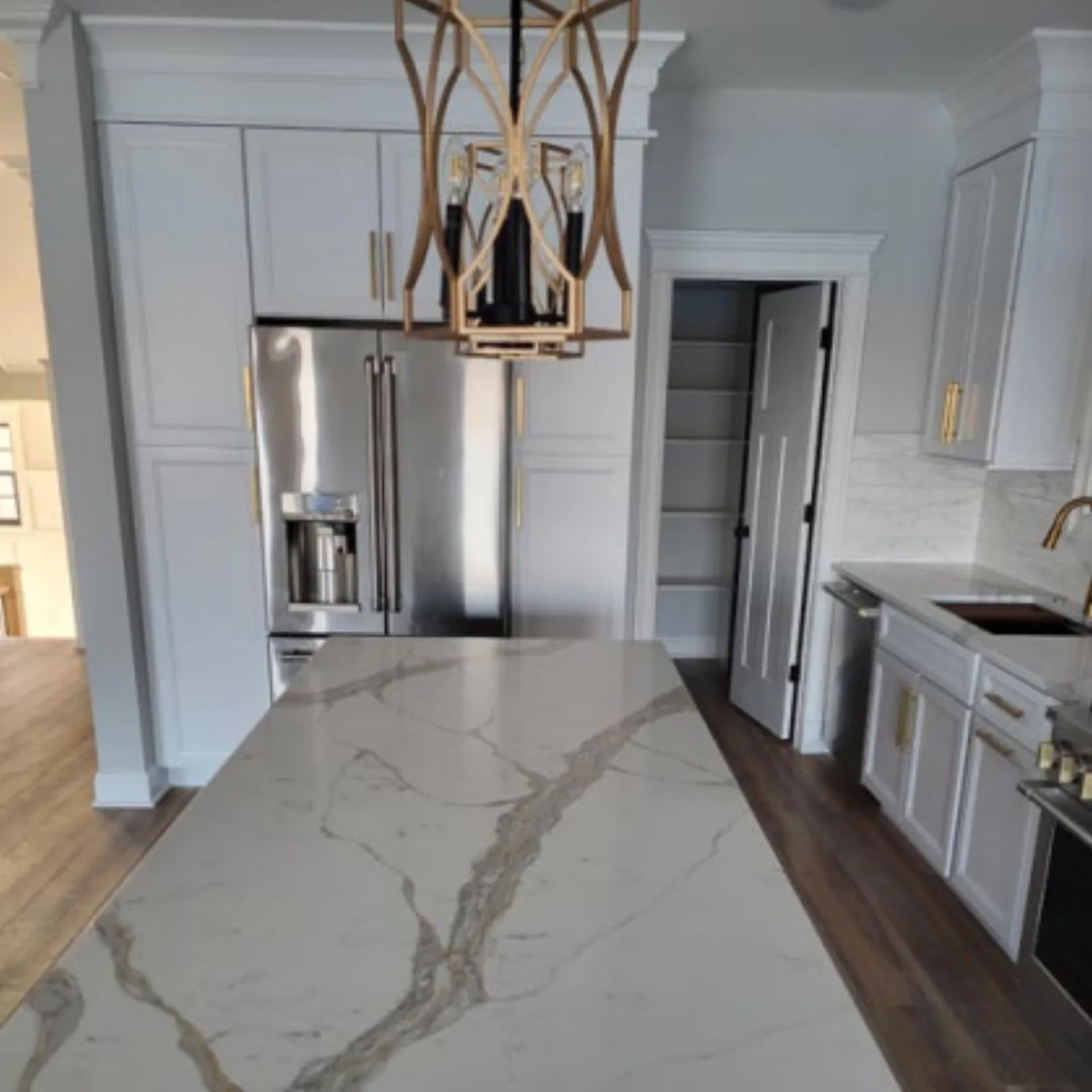 Kitchen island with a marble waterfall edge
