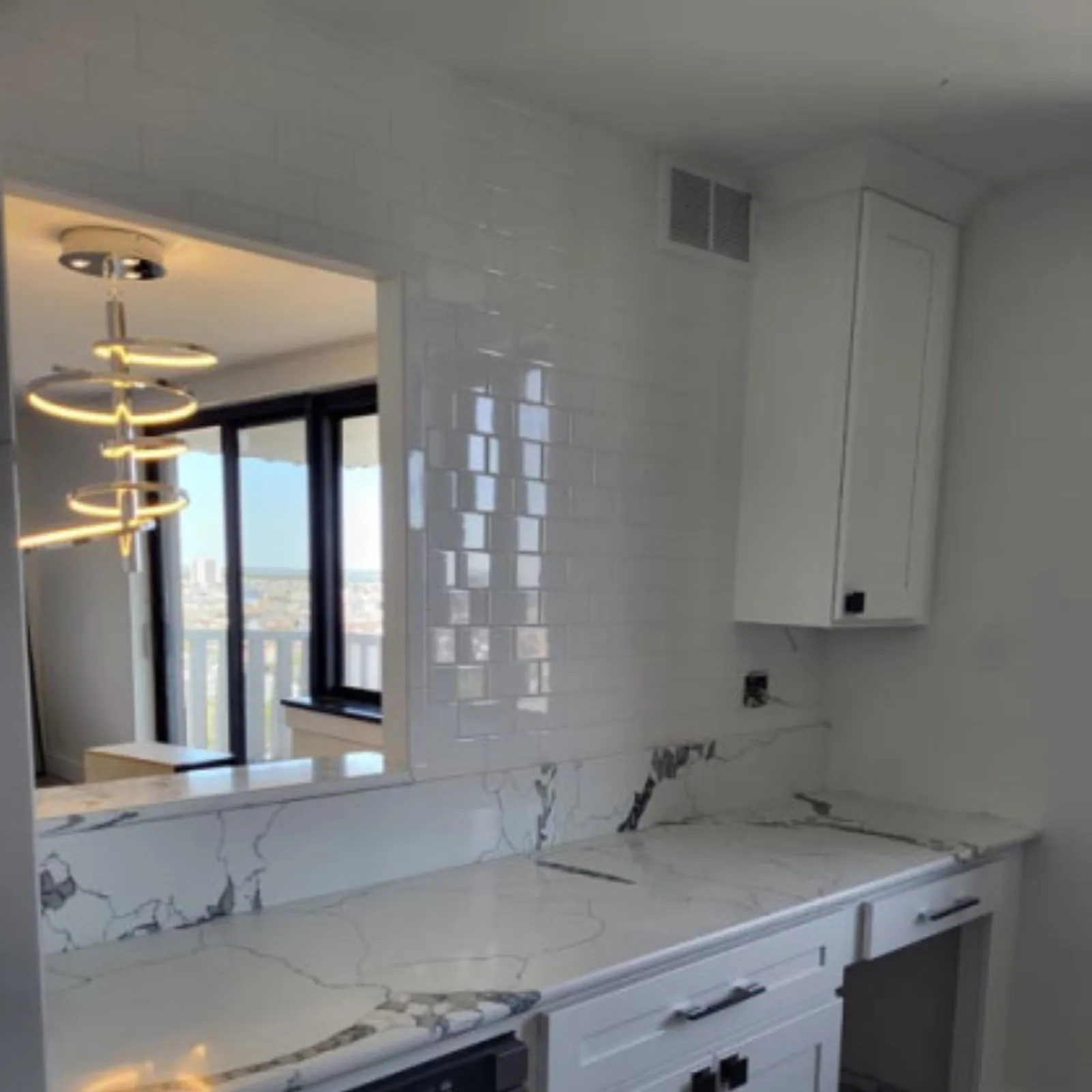 Kitchen renovation in progress with new cabinetry installed
