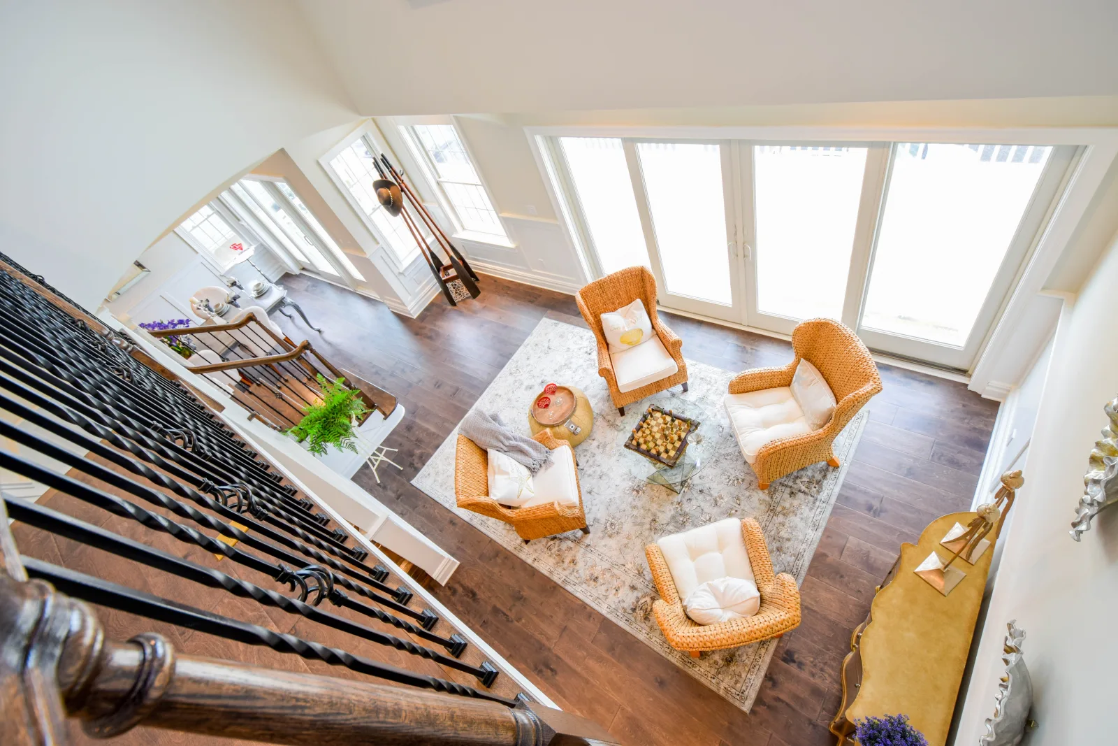 Living room seen from the staircase with wainscoted walls