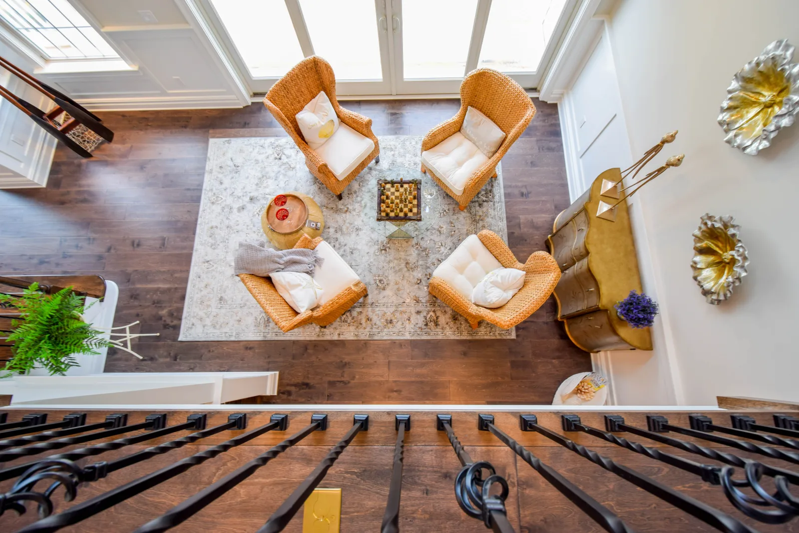 View down from a balcony into a furnished living room