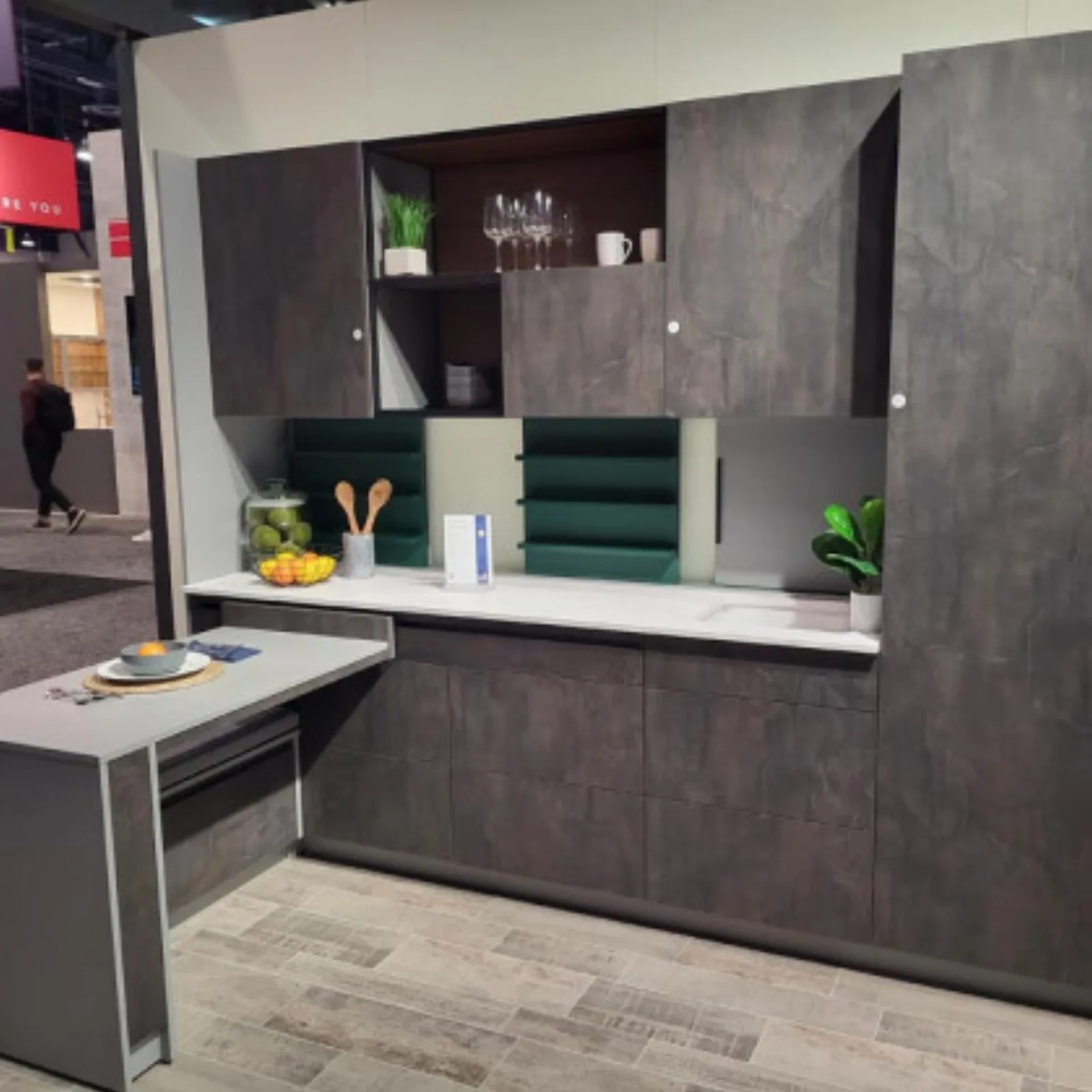 Showroom display of slab front cabinetry with an island